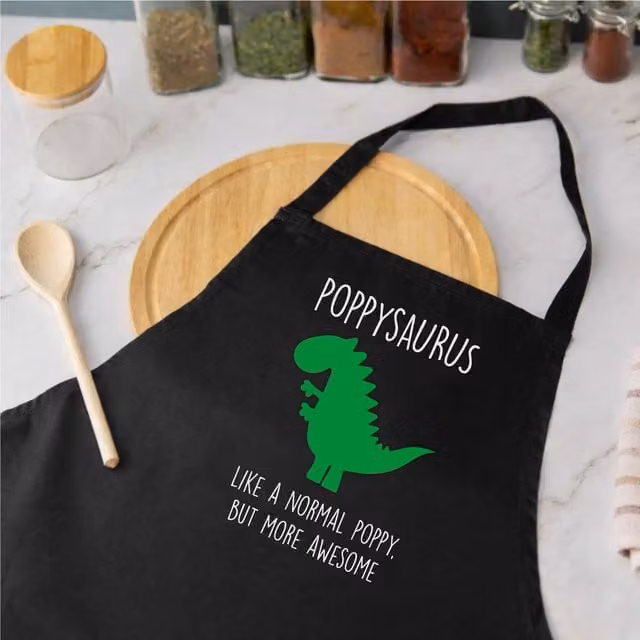 60 Second Makeover Men's Poppysaurus Apron in Black – 1