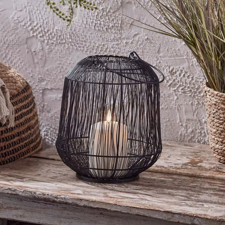 Lights4fun Black Metal Wire Cage Outdoor Garden Lantern with TruGlow Pillar Candle, H 23.5 cm x W 20.5 cm x D 20.5 cm