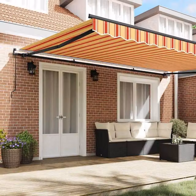 Berkfield Home Manual Retractable Polyester Awning in Yellow and Orange Stripes, W: 500 cm, D: 300 cm – 1