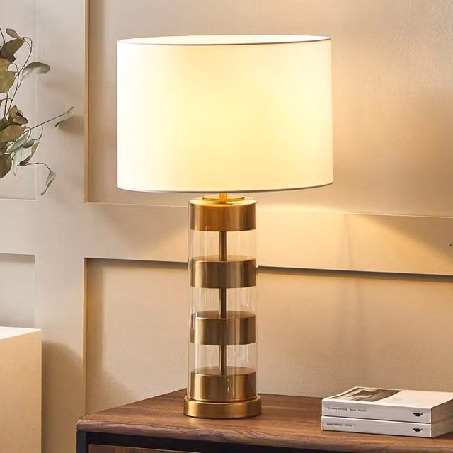 Wyld and Coco Table Lamp with Gold/Brass Glass Base and White Fabric Drum Shade