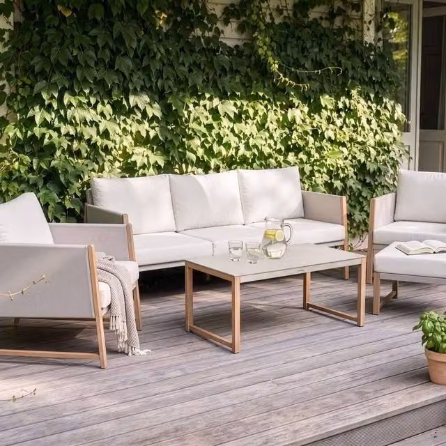 Wyld and Coco 5-Seater Garden Sofa Set with Cushions, Ottoman and Glass Coffee Table in Beige – 1