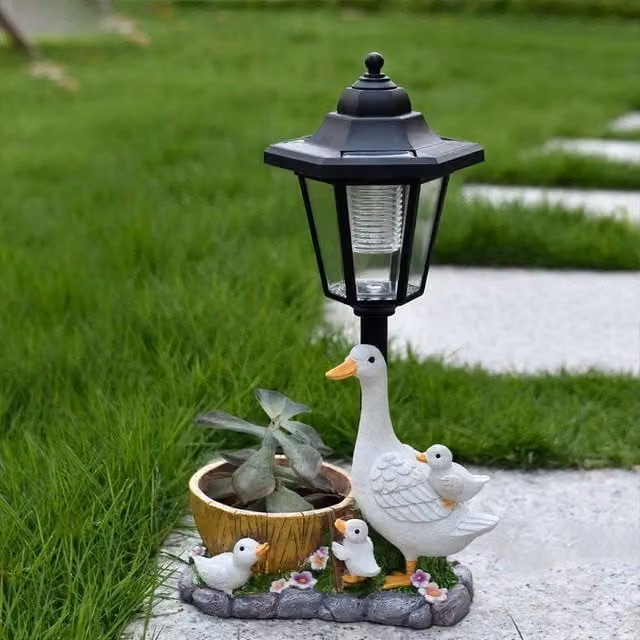 NESTLUNE Solar Duck Garden Statues with LED Lantern Flowerpot in White and Multicolour – 1