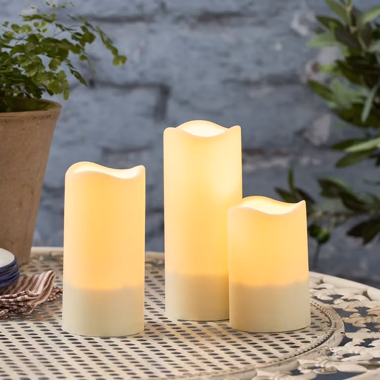 Lights4fun Set of 3 Solar Powered Warm White Flickering Flame LED Flameless Ivory Garden Patio Candles IP44 Rated