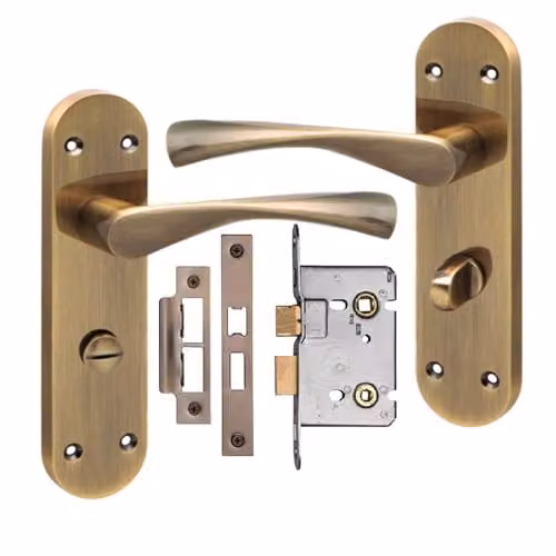 Golden Grace Astrid Bathroom Door Handles with Long Rounded Backplate and Mortise Lock in Antique Brass