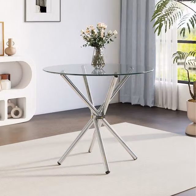 Komore Round Glass Dining Table with Silver Metal X-Frame Legs in Transparent and Chrome