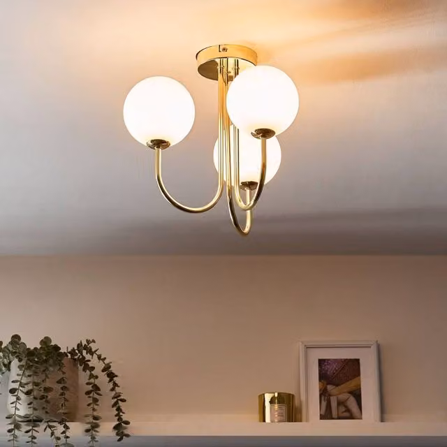 Wyld and Coco Three Light Ceiling Fixture with White Frosted Glass Spheres and Gold Metal Finish