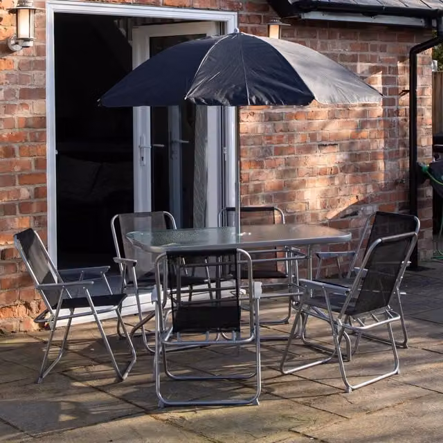 Samuel Alexander 6 Person Garden Furniture Patio Set with Parasol in Black