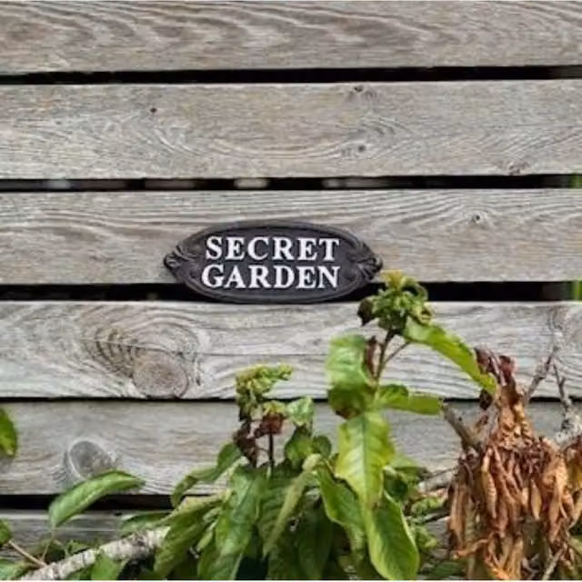 KDMD Secret Garden Oval Metal Wall and Yard Sign in Black