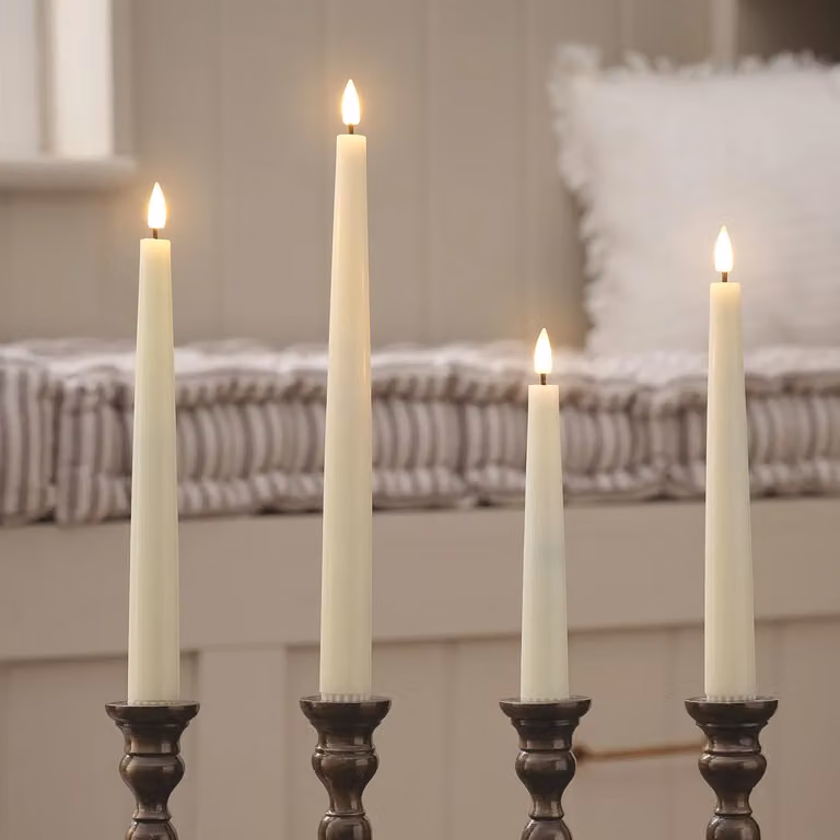 Lights4fun Set of 4 Ivory TruGlow Mixed Height LED Taper Dinner Candles with Remote Control and Timer