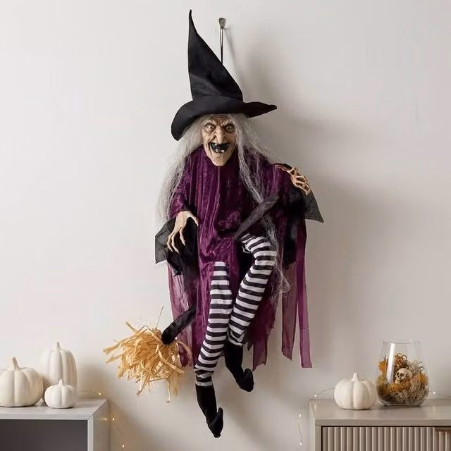 Garden Greatness Animated Cackling Hanging Broom Witch Decoration in Red, Purple and Multicolour