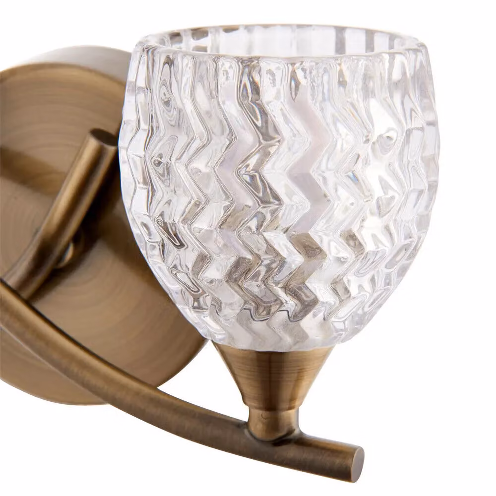Loops LED Twin Wall Light with Twist Arm in Antique Brass and Clear Glass Pattern, Dimmable – 3