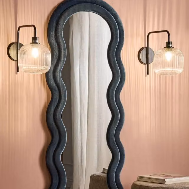 Wyld and Coco Pair of Black Metal Industrial Wall Sconces with Transparent Glass Cylinder Shades