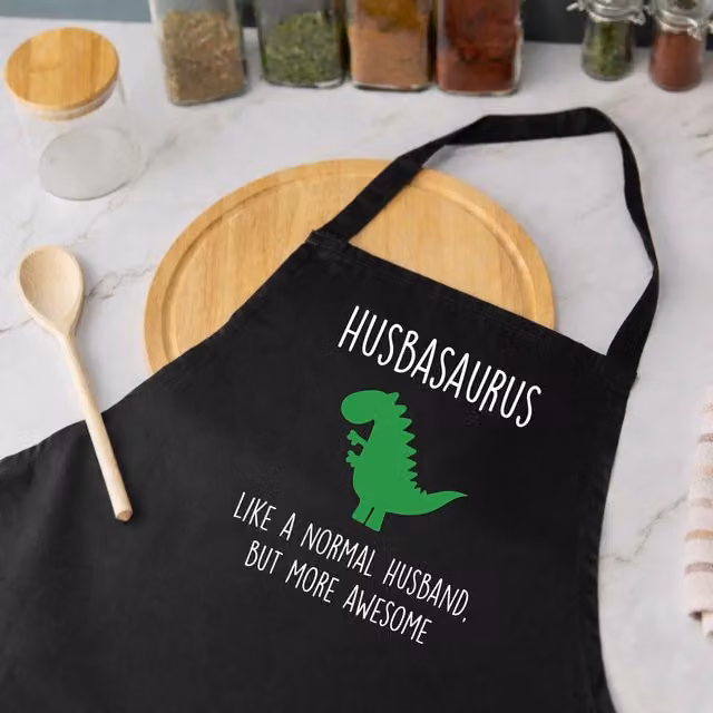 60 Second Makeover Husbasaurus Men's Cotton Apron in Black – 1