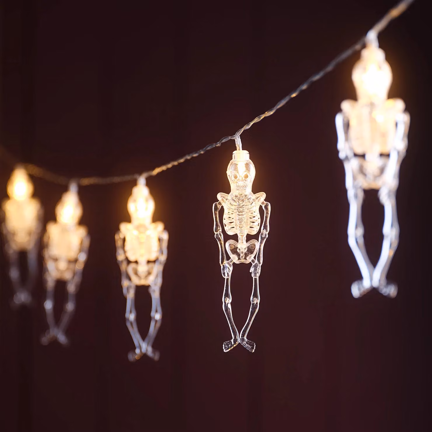 Lights4fun Skeleton Halloween String Lights with 10 Clear White Plastic Skeletons and Warm White LEDs – 1