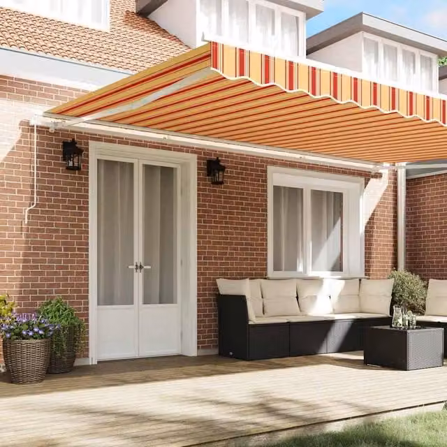 Berkfield Home Manual Retractable Folding Arm Awning in Yellow and Orange Striped Polyester, W: 500 cm, D: 300 cm – 1