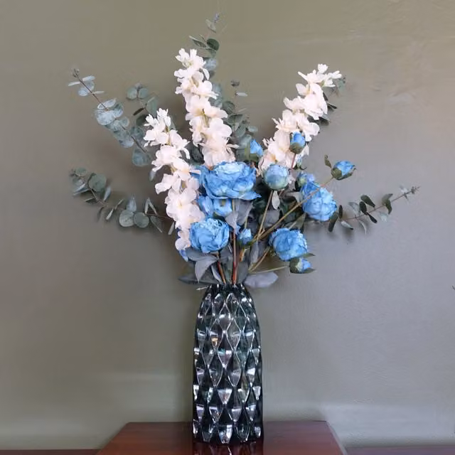 Blue Peony, White Delphinium and Eucalyptus Mixed Flower Arrangement in a Round Glass Vase