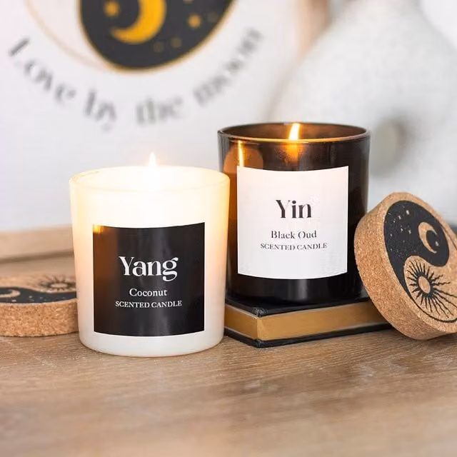 Uniqueful Set of 2 Yin Yang Black Oud and Coconut Scented Candles in Multicolour Glass Figures