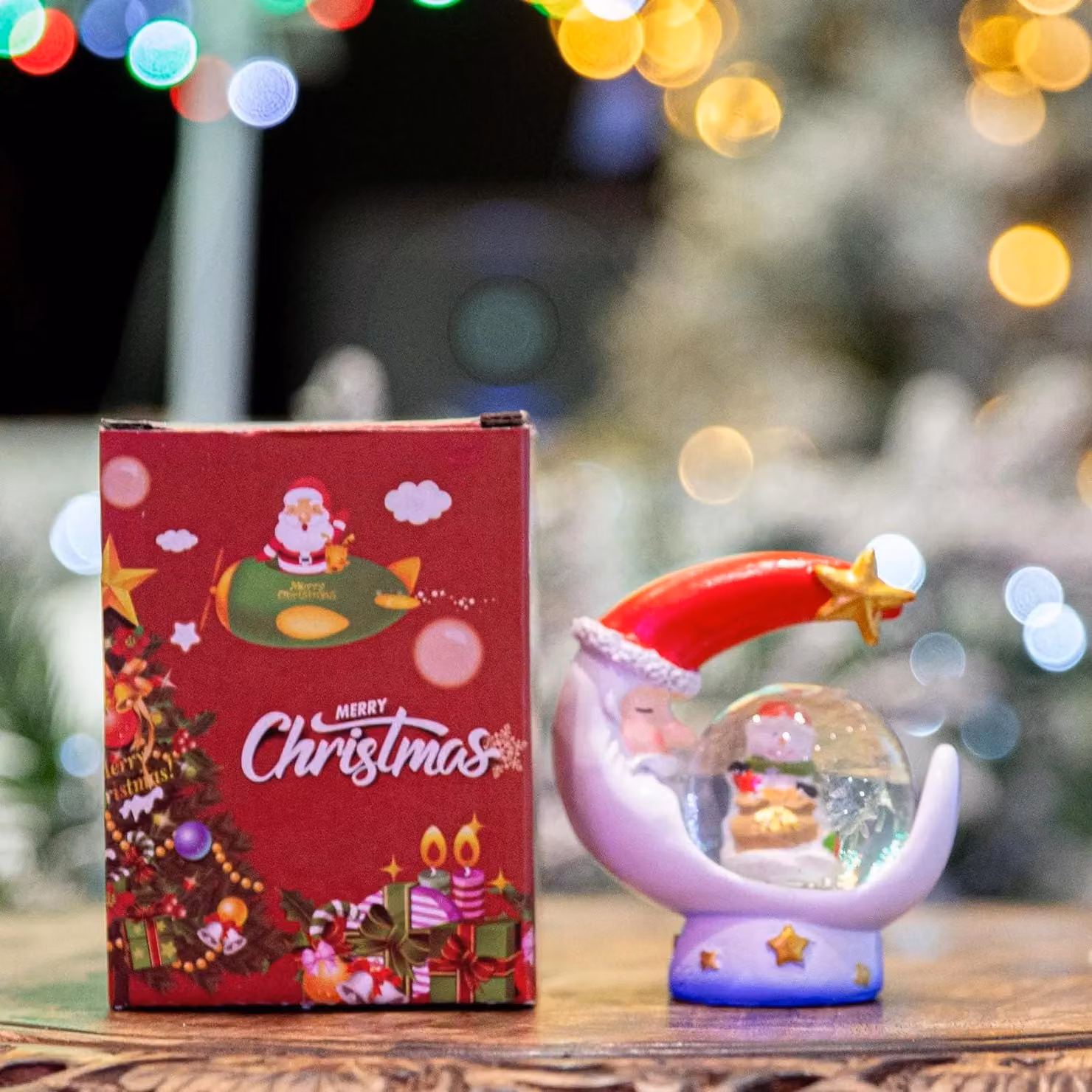 Shatchi Christmas Mini Snowglobe Water Ball with Santa, Reindeer, Snowman and Teddy Scene on a Red Moon Shaped Resin Base – 4