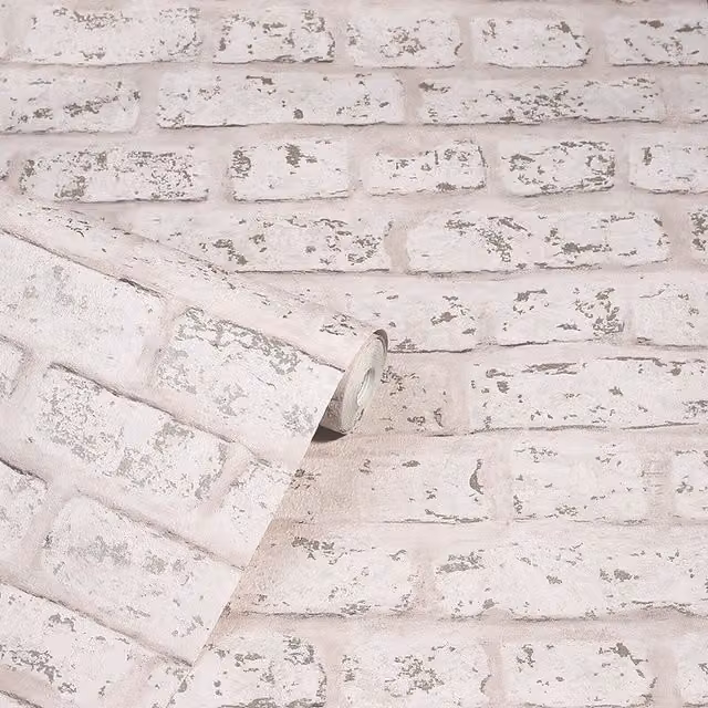 Arthouse Rustic Distressed Brick Wall Effect Metallic Wallpaper in Blush Pink and Grey