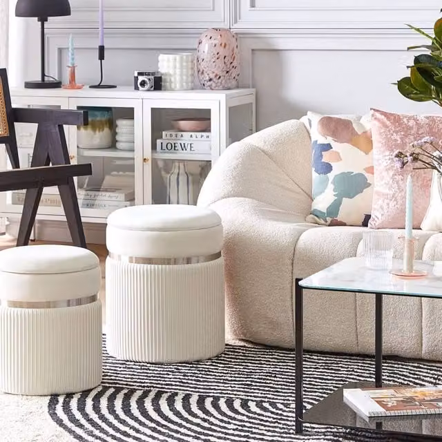 Wyld and Coco Set of 2 Off-White Velvet Cylindrical Pouffes with Metal Bands and Hidden Storage