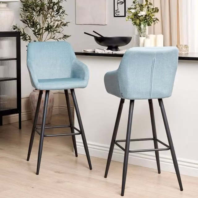 Wyld and Coco Set of 2 Light Blue Velvet Bar Stools with Armrests and Backrest and Black Powder Coated Metal Frame