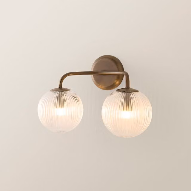 ValueLights Kempton 2 Arm Wall Light with Ribbed Glass Sphere Shade in Gold/Brass