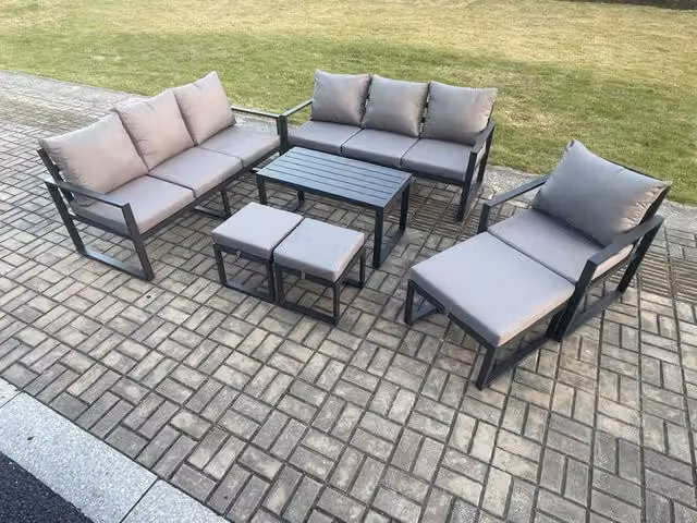 Fimous 7 Piece Powder Coated Aluminium Garden Furniture Set in Dark Grey with Upholstered Cushions, 3 Seater Sofa, Armchair and 3 Ottomans