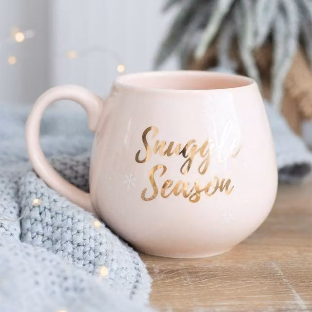 Uniqueful Snuggle Season Ceramic Mug in Pink and Gold