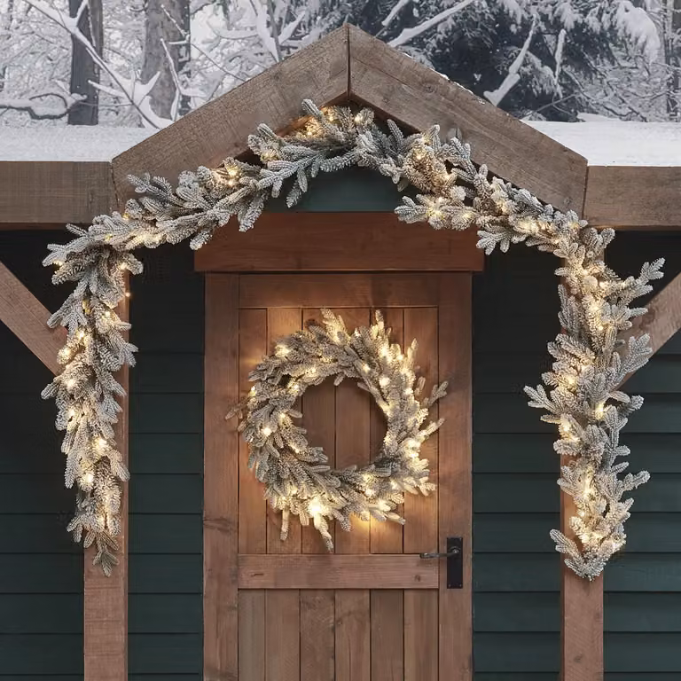Lights4fun Dual LED Pre Lit Artificial Snowy Outdoor Battery Operated Christmas Wreath and Garland Bundle in White and Green