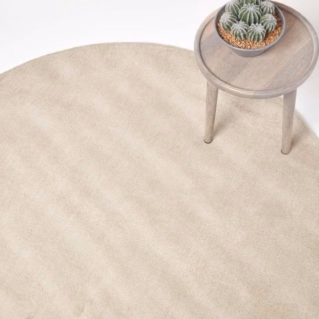Homescapes Hand Tufted Plain Round Cotton Rug in Beige and Yellow, Diameter: 70 cm