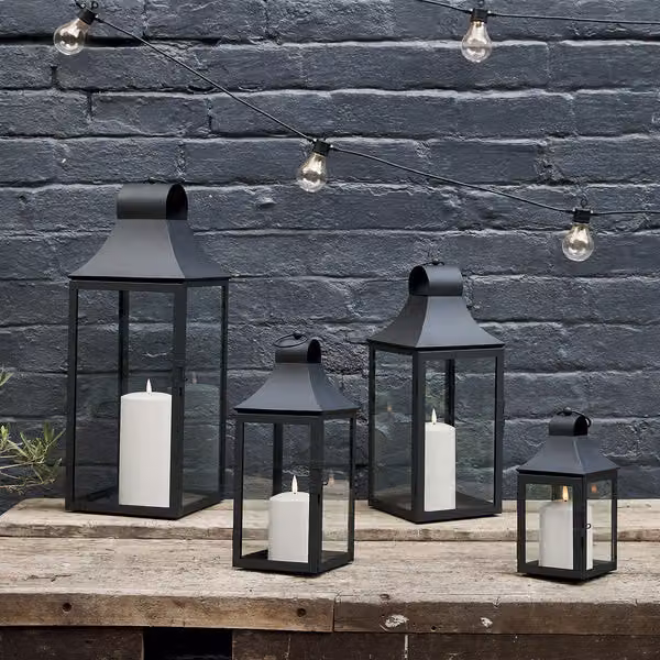 Lights4fun Set of 4 Classic Black Metal Outdoor Garden Lanterns with TruGlow LED Pillar Candles