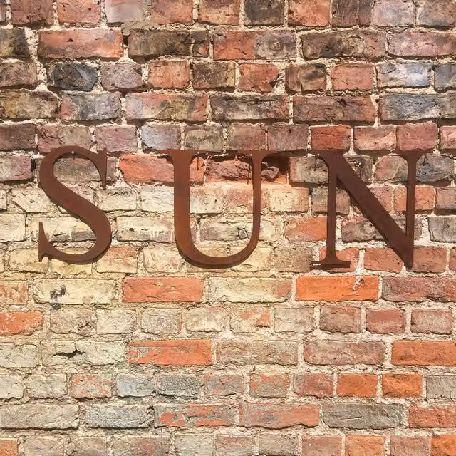 RW Norfolk Sun Letters 12 inch Classic Metal Garden Sign in Rusty Brown