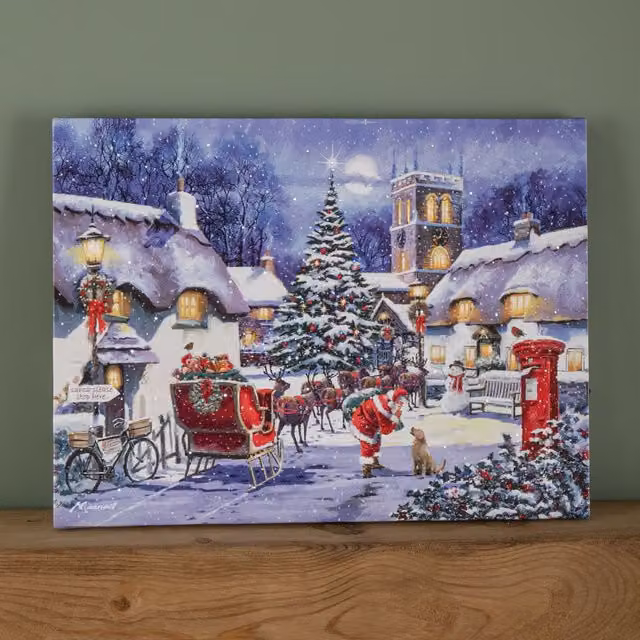 Samuel Alexander Multicolour Battery Operated Light Up Fibre Optic Santa and Village Christmas Wall Canvas W: 40 cm, H: 30 cm