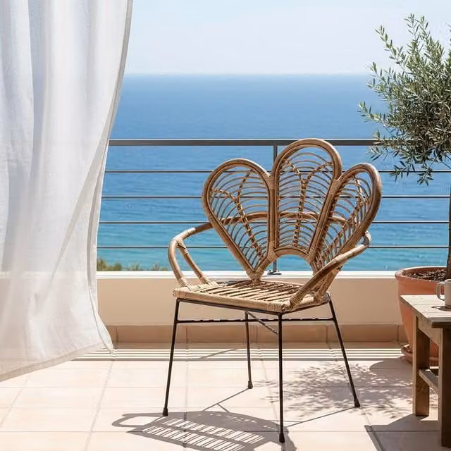 Orsina Natural Brown Rattan Dining Chair with Petal Design and Black Metal Legs