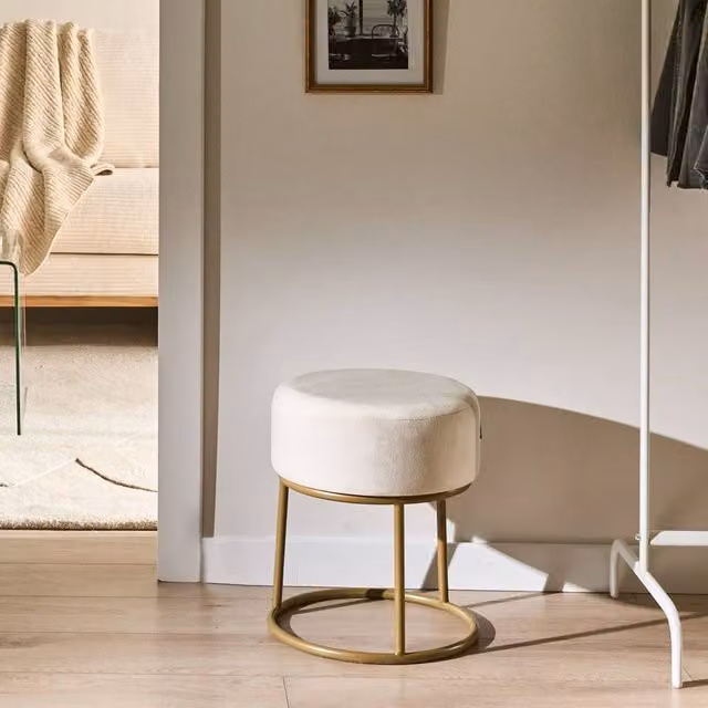 Wyld and Coco Off-White Velvet Cylindrical Footstool with Gold Metal Base