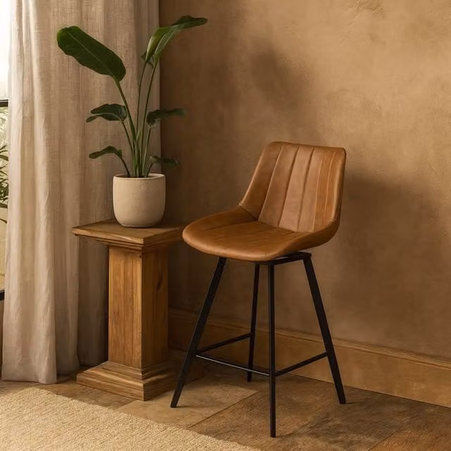 Wyld Haus Brescia Vintage Tan Faux Leather Swivel Bar Stool with Black Metal Legs in Brown