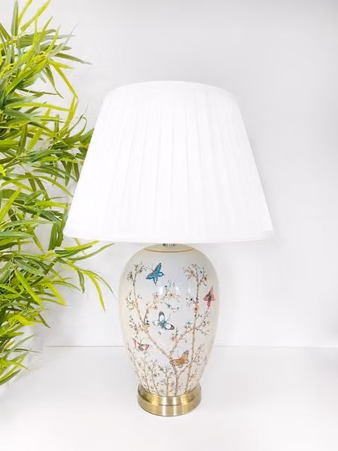 Downton Interiors Grey Butterfly Ceramic Table Lamp with White Pleated Fabric Shade and Gold/Brass Metal Details