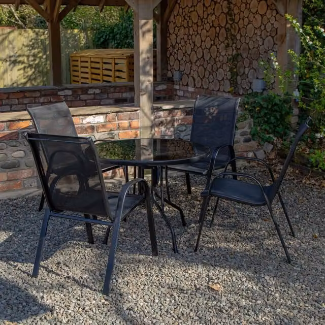 Samuel Alexander Outdoor 4 Person Round Glass Top Garden Dining Table and Chairs Set in Black – 1