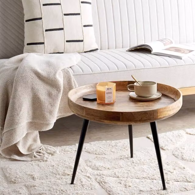 Wyld and Coco Mango Wood Round Coffee Table with Black Four-Leg Base in Brown – 1