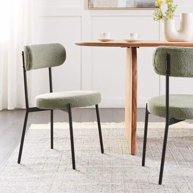 Wyld and Coco Set of 2 Light Green Bouclé Dining Chairs with Black Metal Legs