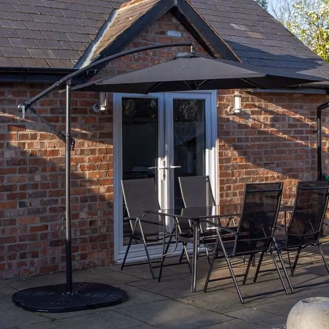 Samuel Alexander 4 Seater Glass Dining Table and Chairs Set with Black Banana Parasol and Base