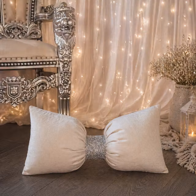 Fabricnco Ltd Plain Square Velvet Bow Cushion in Beige