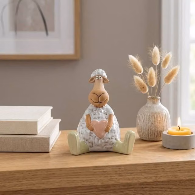 Garden Greatness Sitting Sheep Holding Heart Ornament in Multicolour