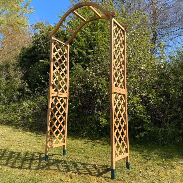 Brown Wooden Garden Trellis Arch with Curved Top and Ground Spikes for Climber Support