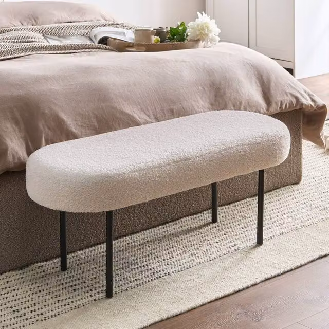 Wyld and Coco Off-White Boucle Oval Bench with White Metal Legs