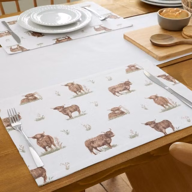 Catherine Lansfield Angus Highland Cow Wipe Clean Cotton Placemat in Natural Beige and White