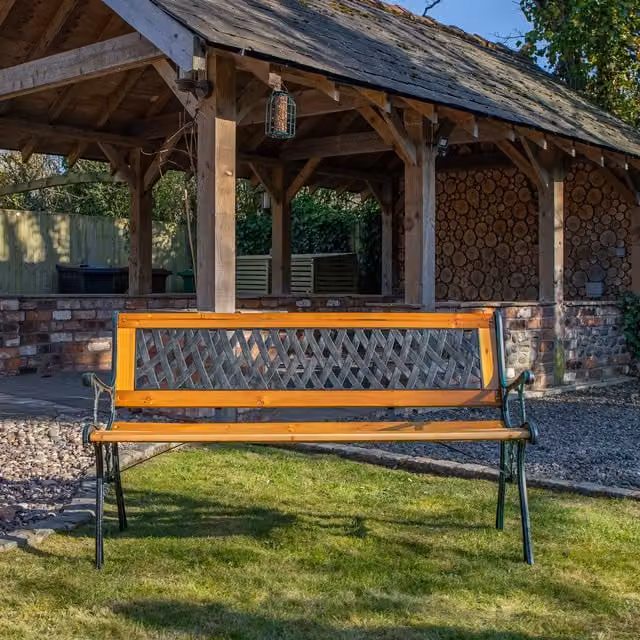 Samuel Alexander 2 Seater Brown Wooden and Cast Iron Garden Patio Bench with Lattice Design W/D/H: 119 x 73 x 34 cm