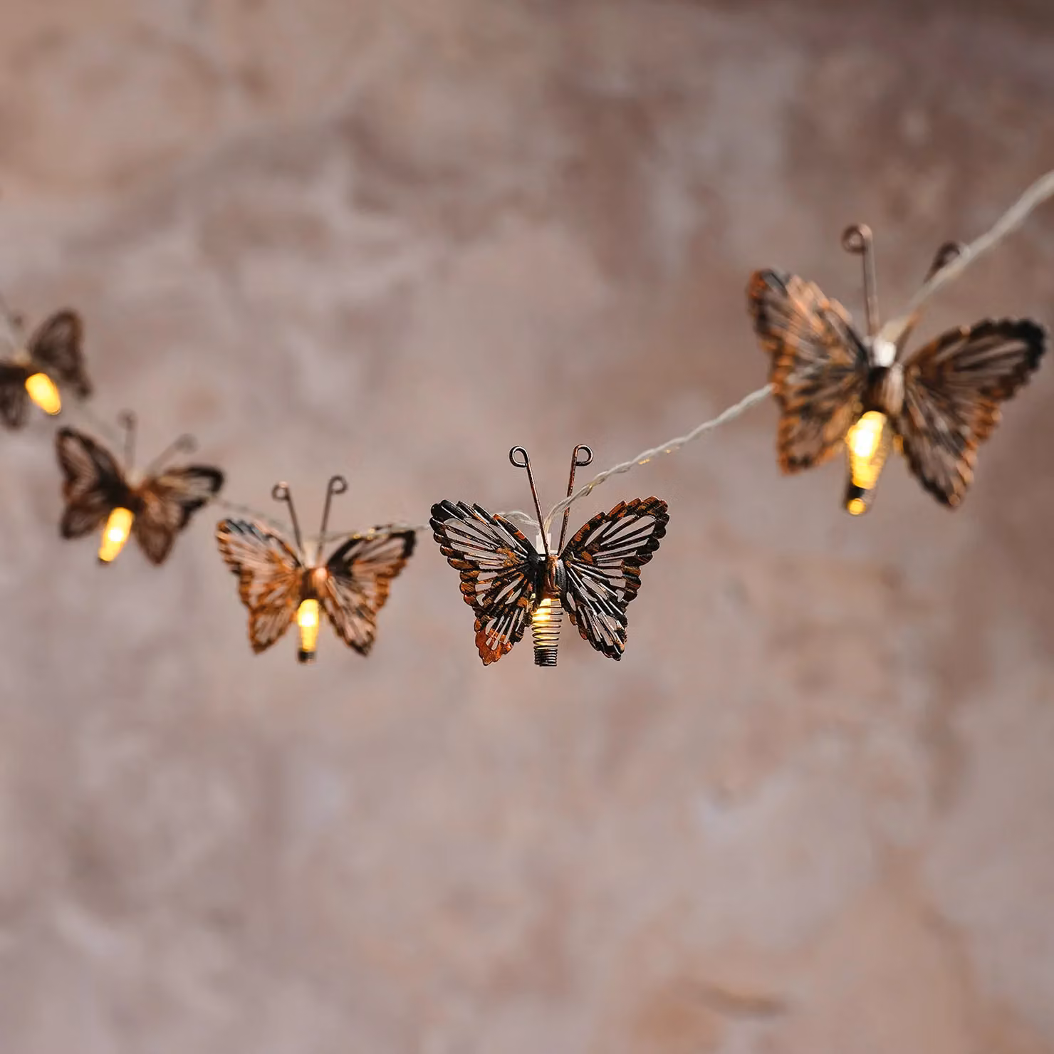 Lights4fun 10 Butterfly Solar LED Fairy Lights in Warm White with Copper and Bronze Metal Details