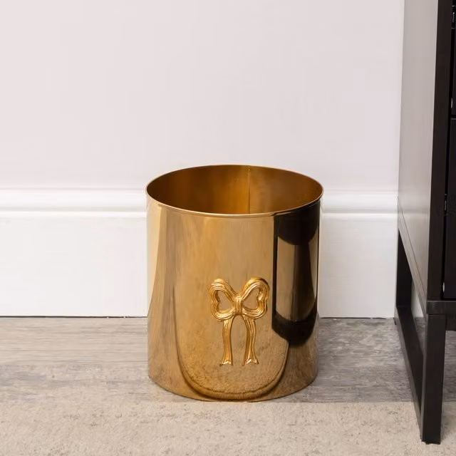 Melody Maison Round Shiny Gold and Black Metal Bow Waste Bin – 1