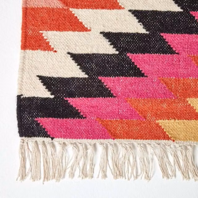 Homescapes Jakarta Handwoven Geometric Pattern Kilim Wool Rug, Multicolour (Pink, Yellow, Orange) with Fringes, Width: 200 cm